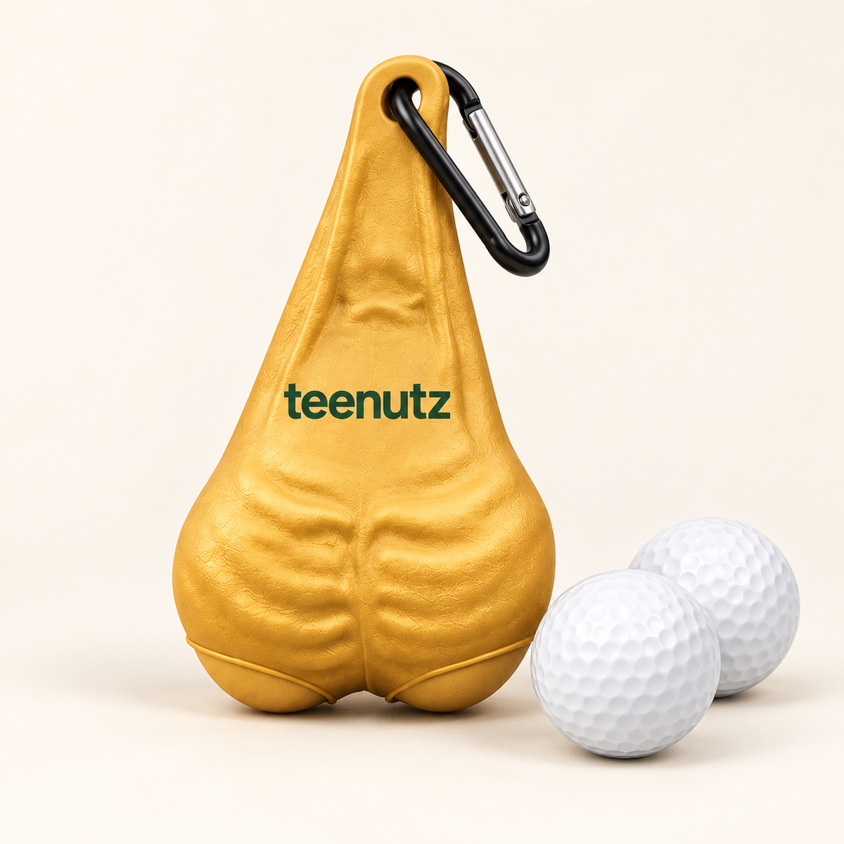 Studio illustration of a gold teenutz holder with two white golf balls and an attached black-and-silver clip